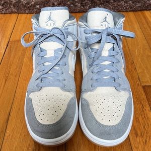Air Jordan 1 mid top coconut milk is the color from description
